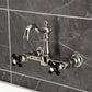 Kingston KS2443PKX Duchess Two-Handle Wall Mount Bridge Kitchen Faucet, Antique Brass with black handles