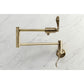 Kingston Brass KS4103DFL NuWave Wall Mount Pot Filler Faucet, Antique Brass on marble backdrop