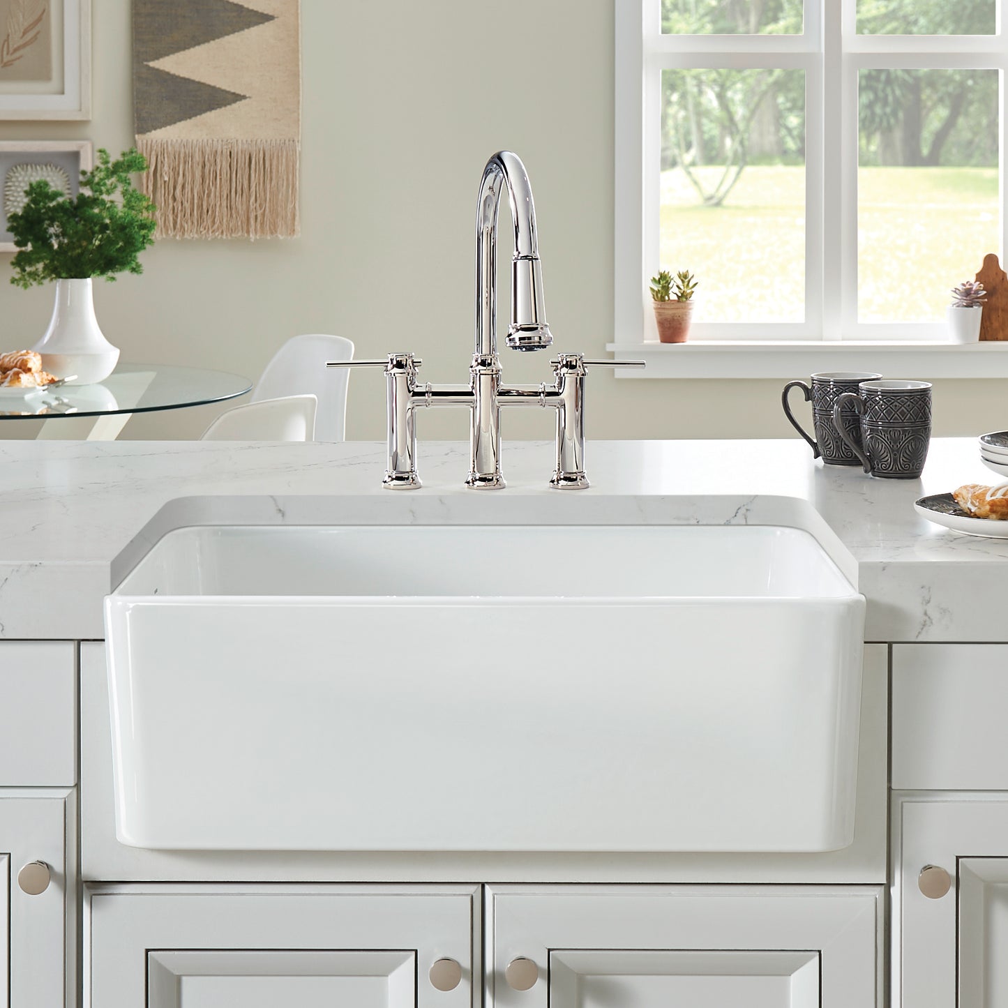 Cerana 30" Fireclay Single Bowl Apron-Front Farmhouse Sink - White with modern faucet in a bright kitchen setting.