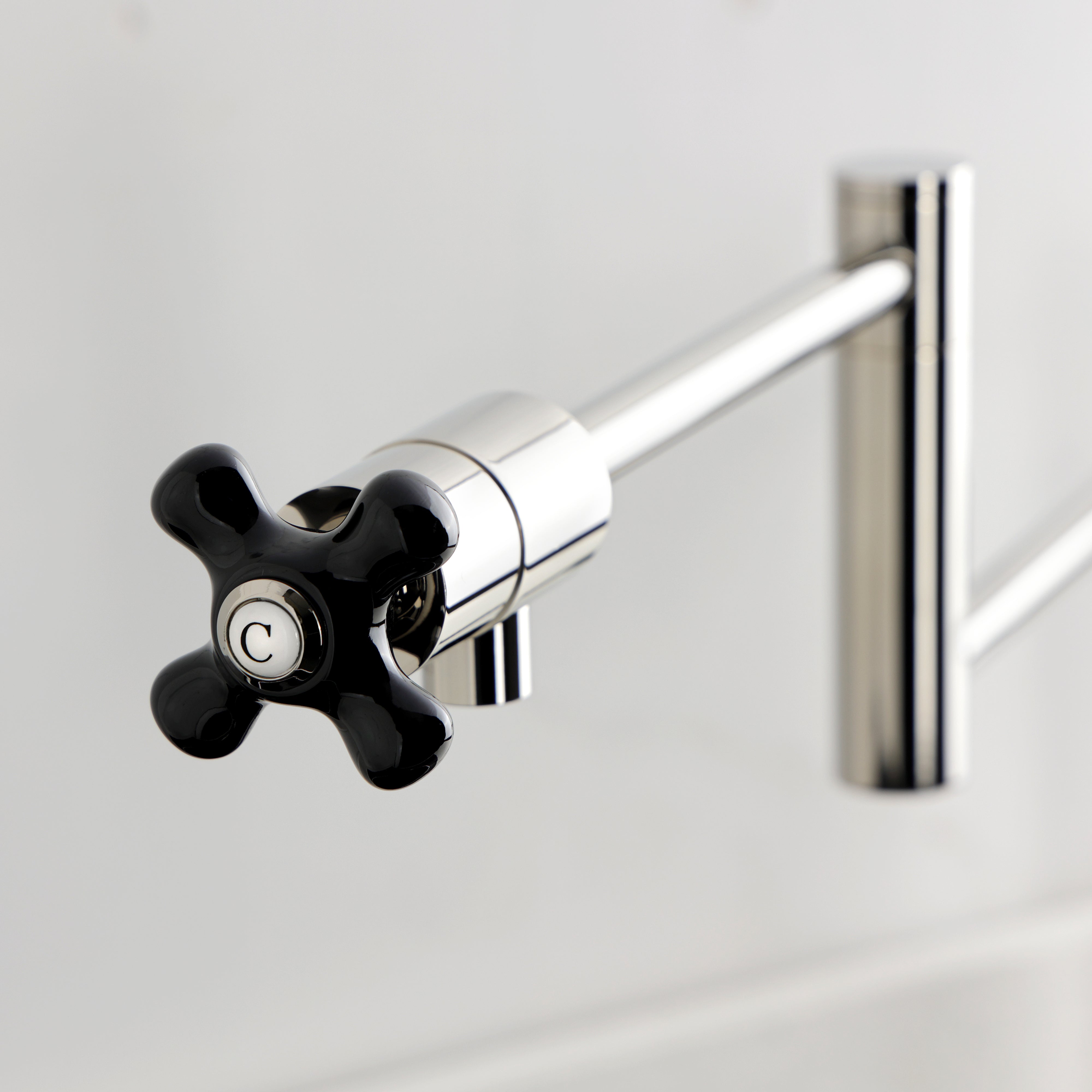 Kingston Brass KS4703PKX Duchess Deck Mount Pot Filler Faucet, Antique Brass black porcelain handle detail