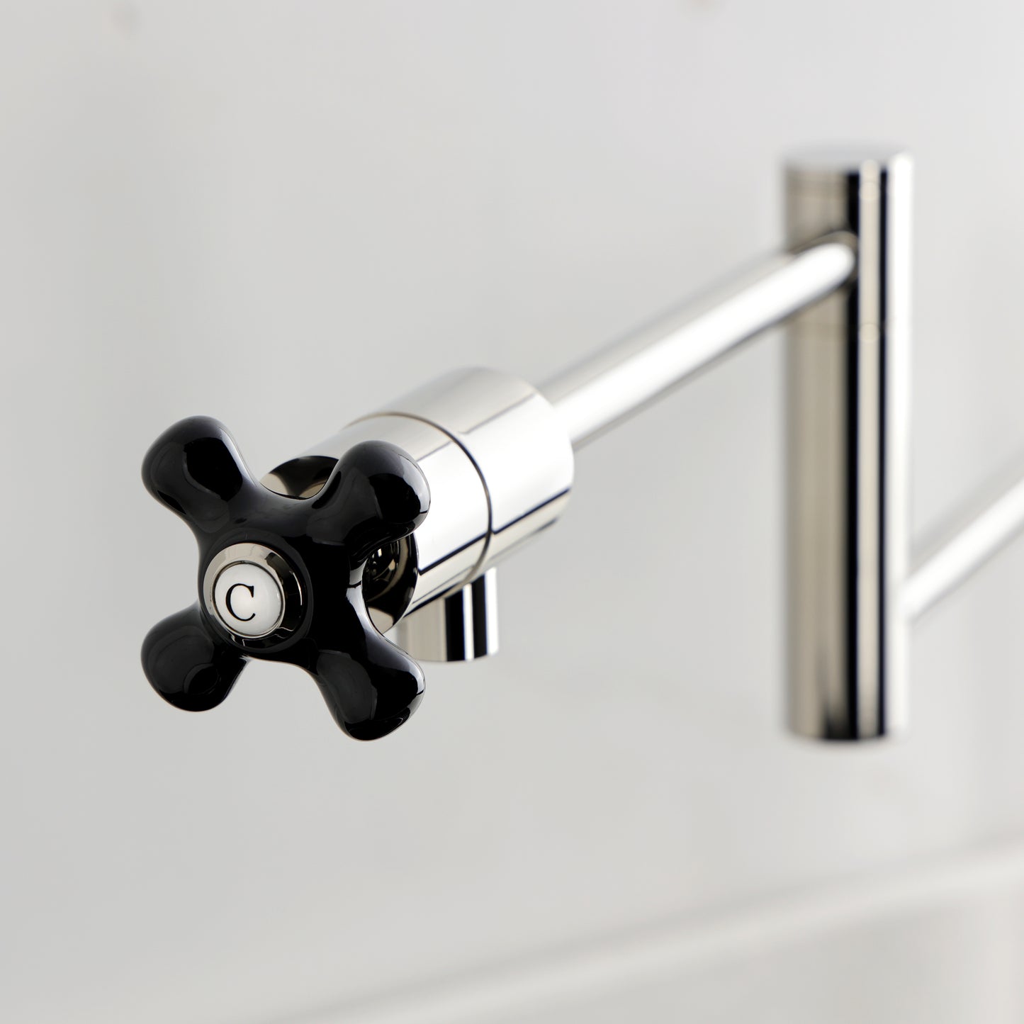 Kingston Brass KS4703PKX Duchess Deck Mount Pot Filler Faucet, Antique Brass black porcelain handle detail