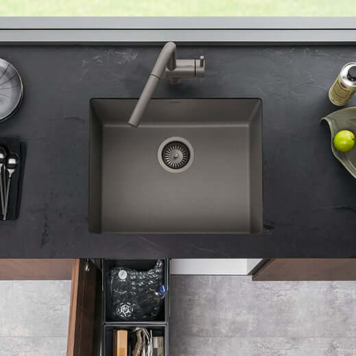 BLANCO PRECIS 24" SILGRANIT Compact Undermount Sink in a modern kitchen setting with sleek design and faucet.