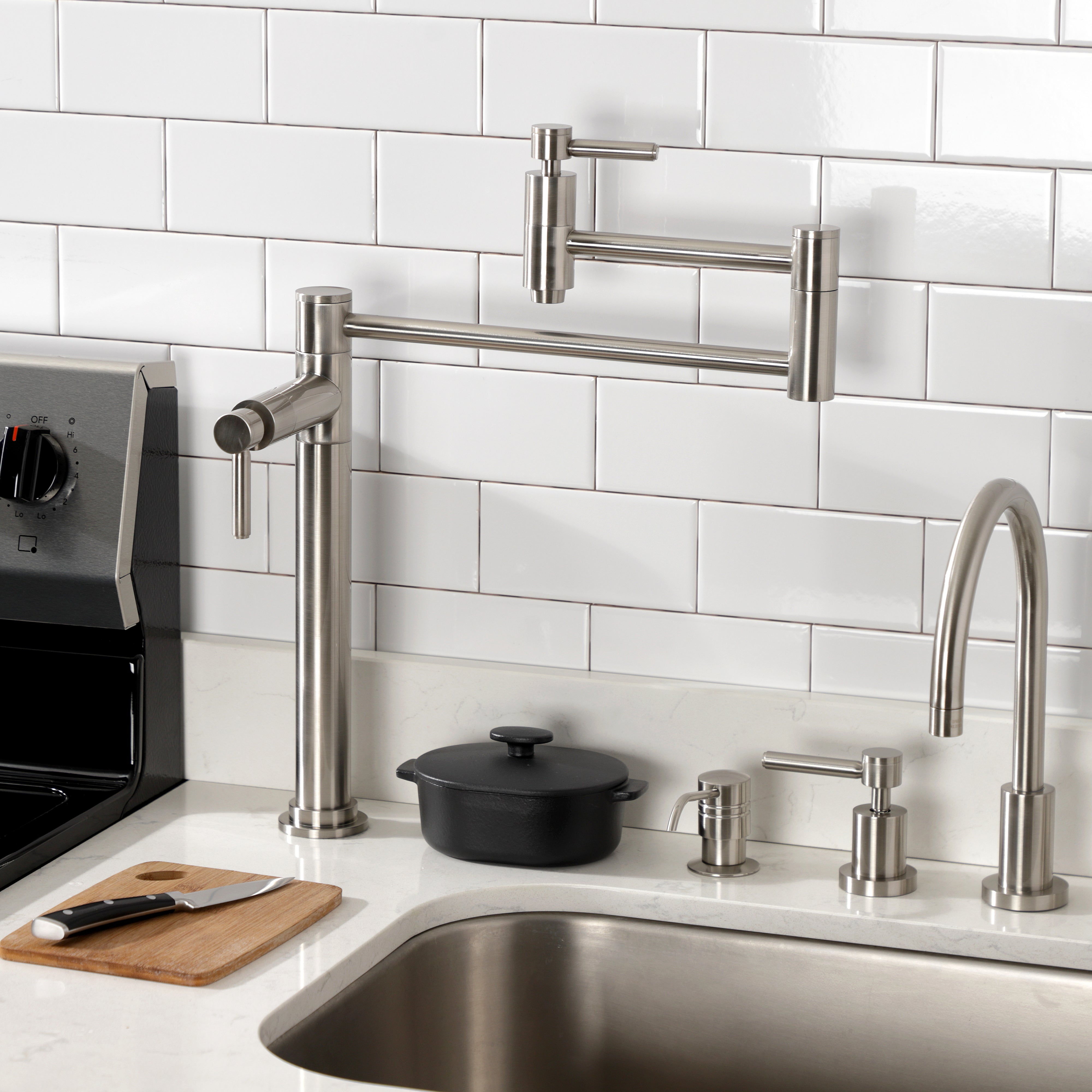 Kingston Brass KS870DLAC Concord Deck Mount Pot Filler Faucet, Antique Copper mounted in a modern kitchen setting.