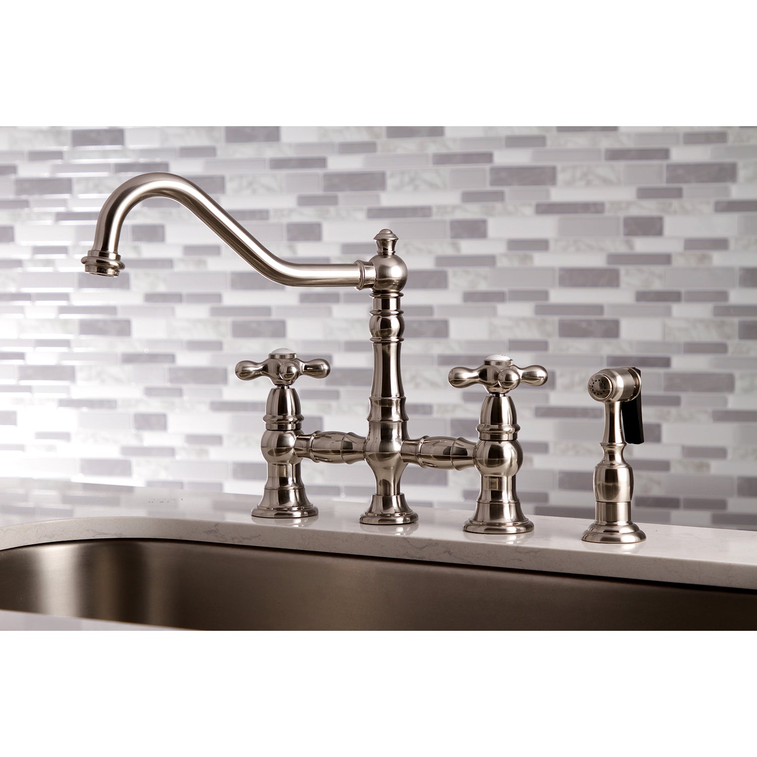 Kingston KS3277AXBS Restoration Bridge Kitchen Faucet with Brass Sprayer, Brushed Brass in traditional kitchen setting.