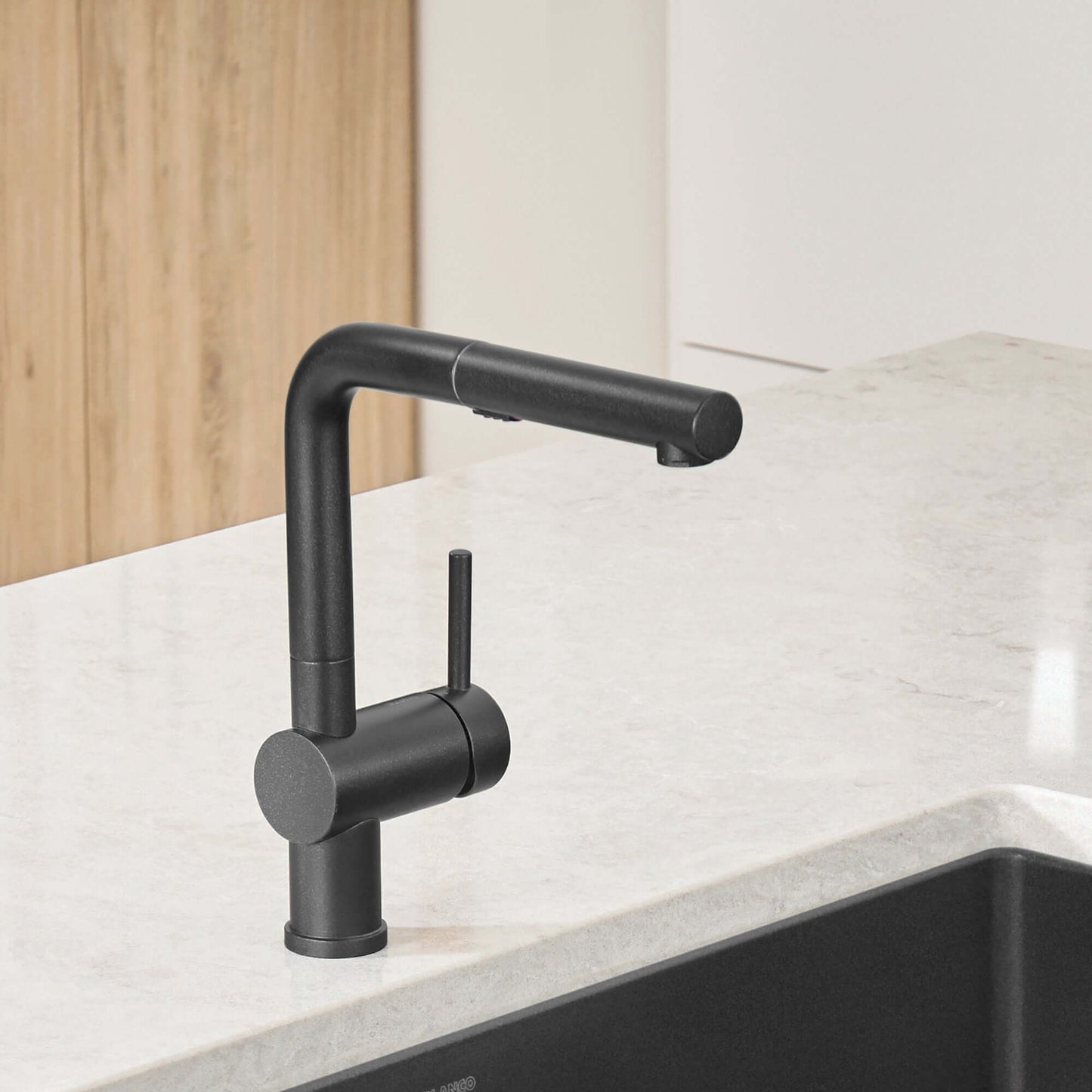 BLANCO Linus Low Arc Pull-Out Dual-Spray Kitchen Faucet - Anthracite on a kitchen countertop.