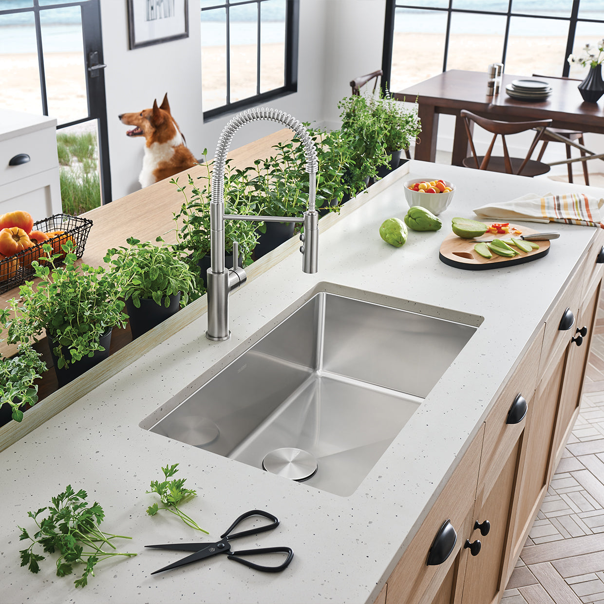 BLANCO Cuvee R15 32" Single Bowl Undermount Stainless Steel Kitchen Sink with modern faucet and fresh herbs.