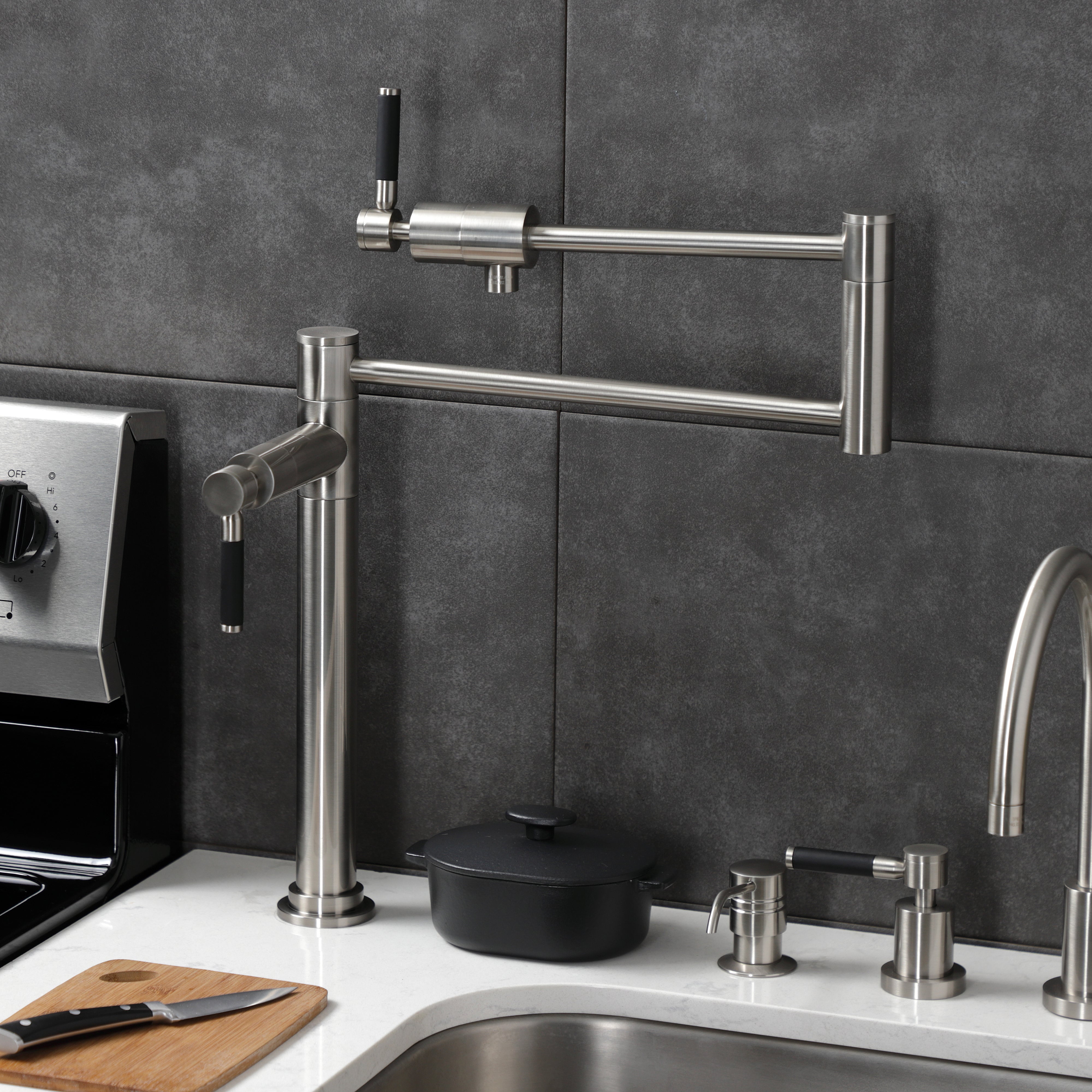 Kingston Brass KS4703DKL Kaiser Deck Mount Pot Filler Faucet, Antique Brass in a modern kitchen setting.