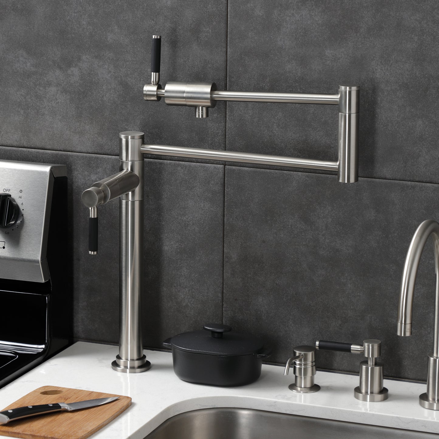 Kingston Brass KS4703DKL Kaiser Deck Mount Pot Filler Faucet, Antique Brass in a modern kitchen setting.
