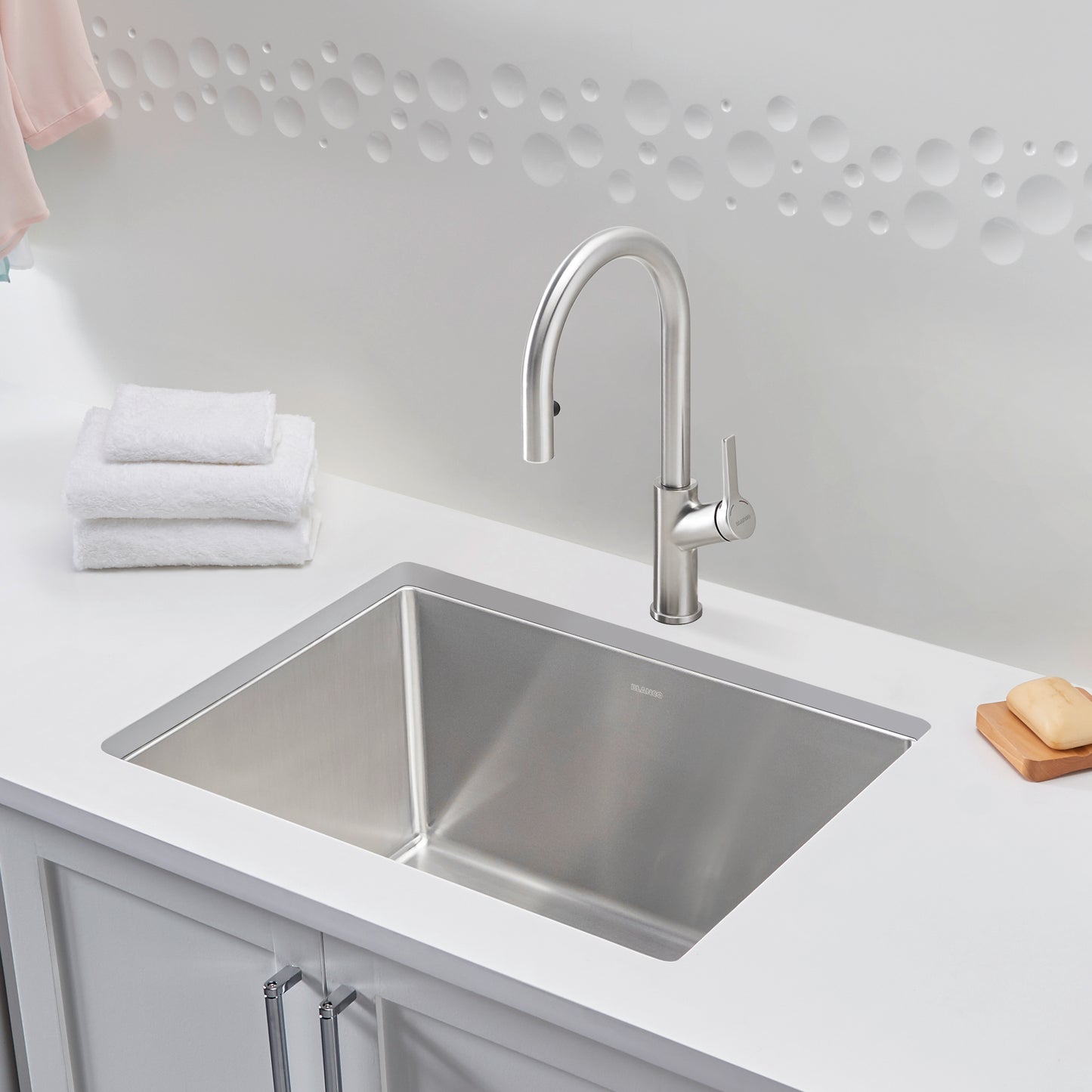 BLANCO Quatrus R15 25" Single Bowl Dual Mount Stainless Steel Laundry Sink with modern faucet and clean towels.