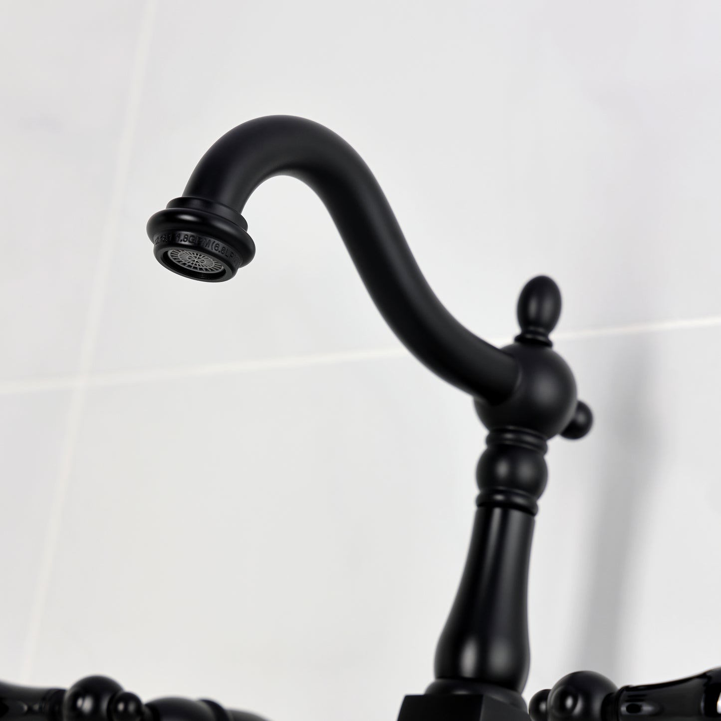Kingston KS1263PKL Duchess Two-Handle Wall Mount Bridge Kitchen Faucet, Antique Brass spout detail
