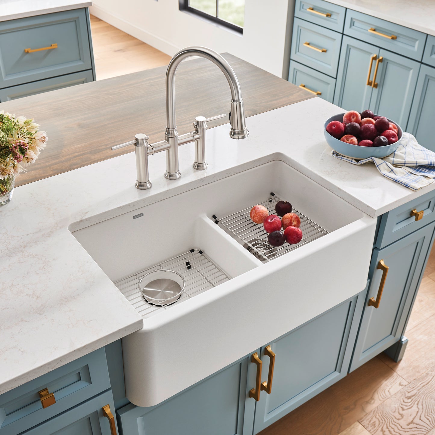 BLANCO Ikon SILGRANIT 33" Double Bowl Apron-Front Farmhouse Sink with Low Divide in modern kitchen.