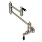 Kingston Brass KS3103PKL Duchess Wall Mount Pot Filler Faucet, Antique Brass with black porcelain handles.