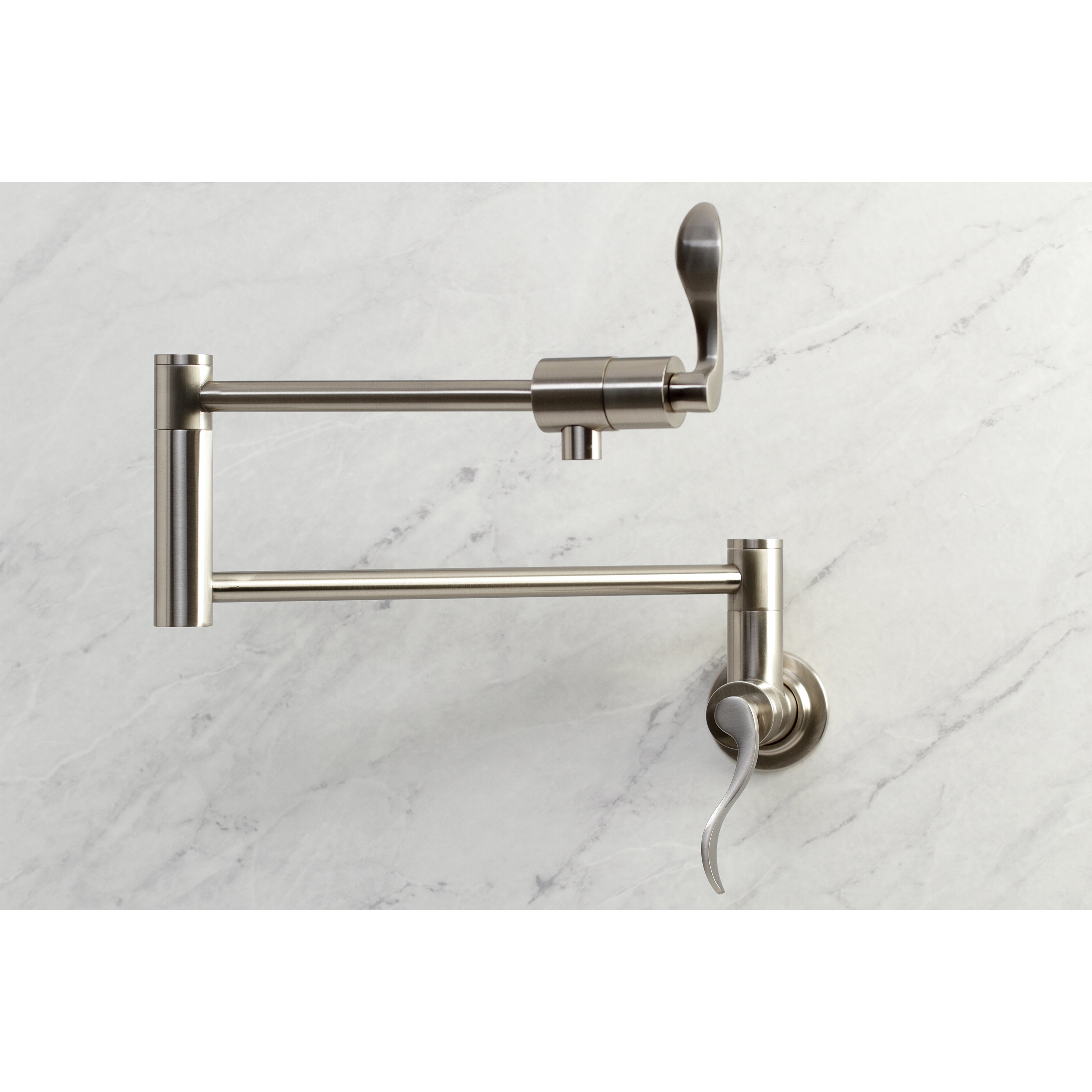 Kingston Brass KS4103DFL NuWave Wall Mount Pot Filler Faucet, Antique Brass on marble surface.