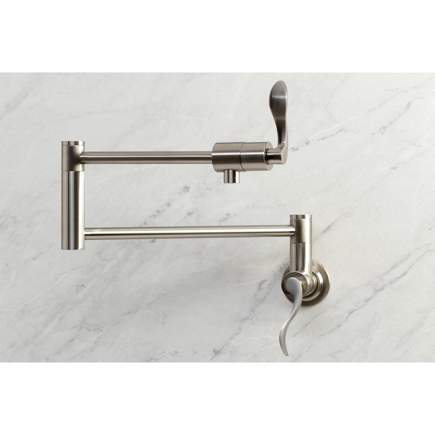 Kingston Brass KS4103DFL NuWave Wall Mount Pot Filler Faucet, Antique Brass on marble surface.