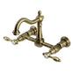Kingston KS1263TAL Tudor Two-Handle Wall Mount Bridge Kitchen Faucet, Antique Brass with vintage design.