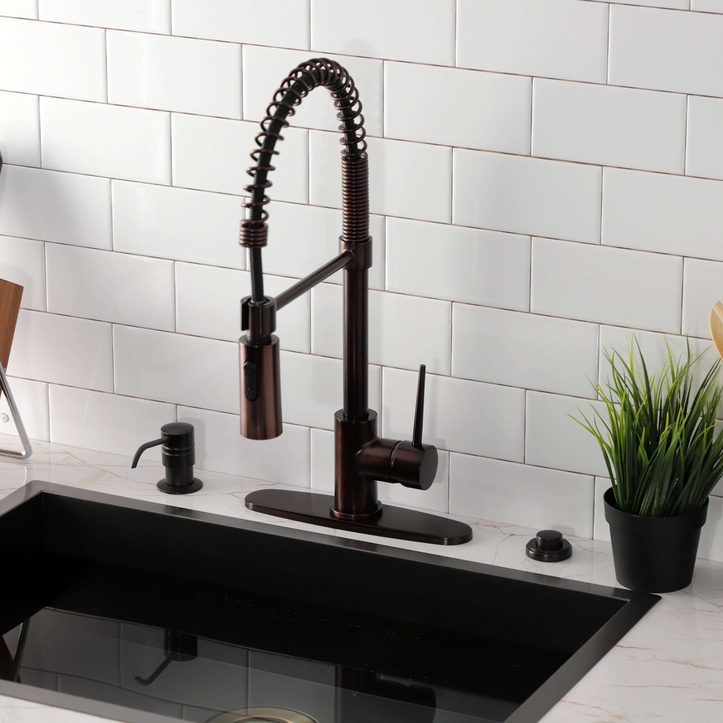 Kingston Brass LS8778NYL New York Pre-Rinse Kitchen Faucet viewed from the front with black sink and white backsplash.