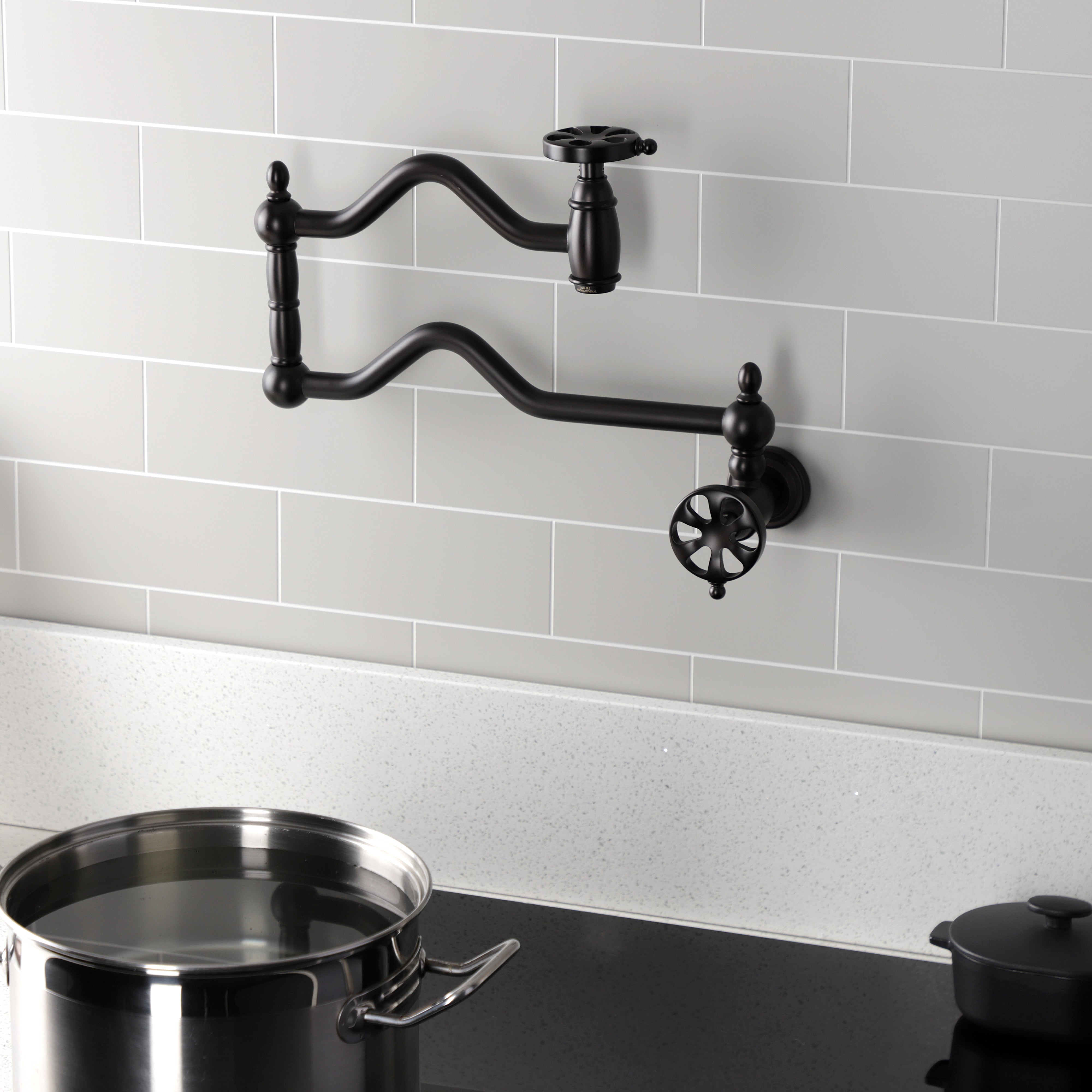 Kingston Brass KS2107RX Belknap Wall Mount Pot Filler Faucet, Brushed Brass in a stylish kitchen setting