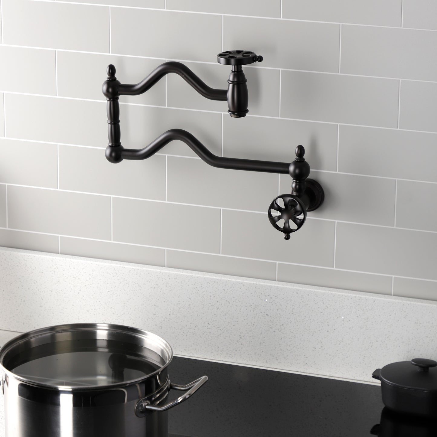 Kingston Brass KS2107RX Belknap Wall Mount Pot Filler Faucet, Brushed Brass in a stylish kitchen setting
