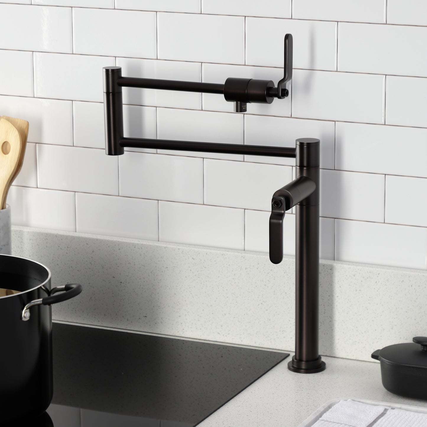 Kingston Brass KS4703KL Whitaker Deck Mount Pot Filler Faucet, Antique Brass in a modern kitchen setting.