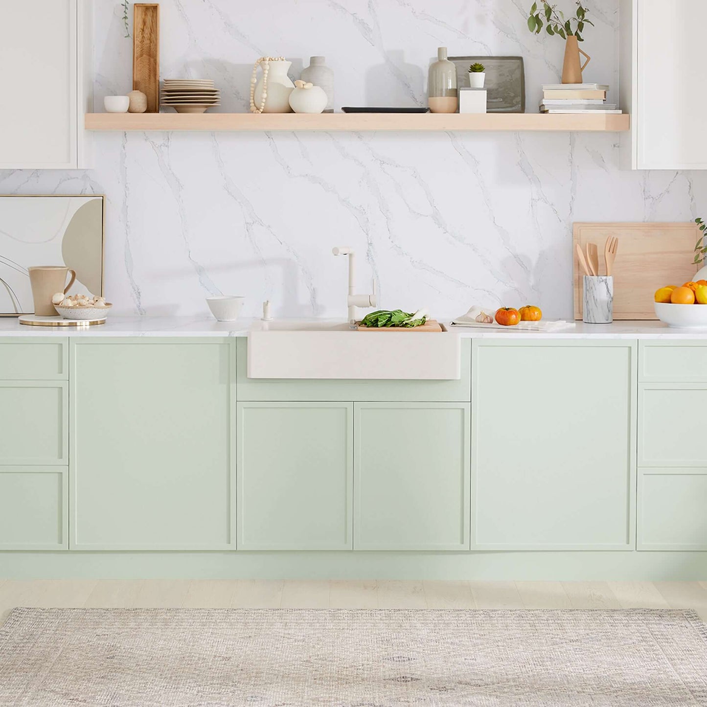 BLANCO VINTERA 30" SILGRANIT Single Bowl Farmhouse Sink in a stylish kitchen with light green cabinets.