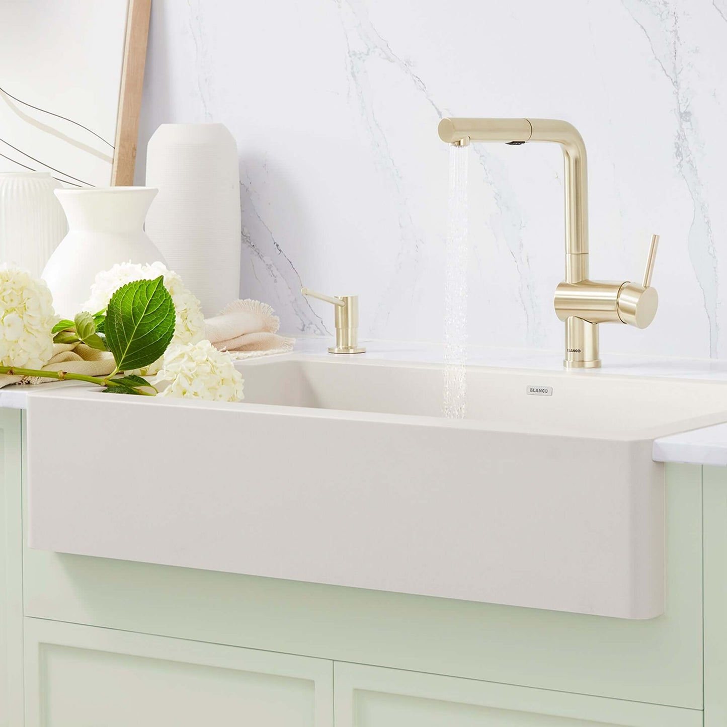 BLANCO Linus Low Arc Pull-Out Dual-Spray Kitchen Faucet - in a modern kitchen sink with floral decor.
