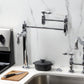 Kingston Brass KS3703BAL Heirloom Deck Mount Pot Filler Faucet, Antique Brass in a modern kitchen setting.