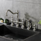 Kingston KS3277ALBS Restoration Bridge Kitchen Faucet with Brass Sprayer, Brushed Brass in a modern kitchen setting.