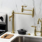 Kingston Brass KS3703AL Restoration Deck Mount Pot Filler Faucet, Antique Brass displayed in a modern kitchen setting.
