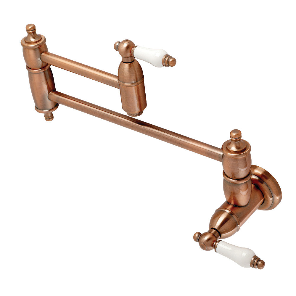 Kingston Brass KS3103PL Restoration Wall Mount Pot Filler Faucet, Antique Brass with swing arms and white ceramic handles.