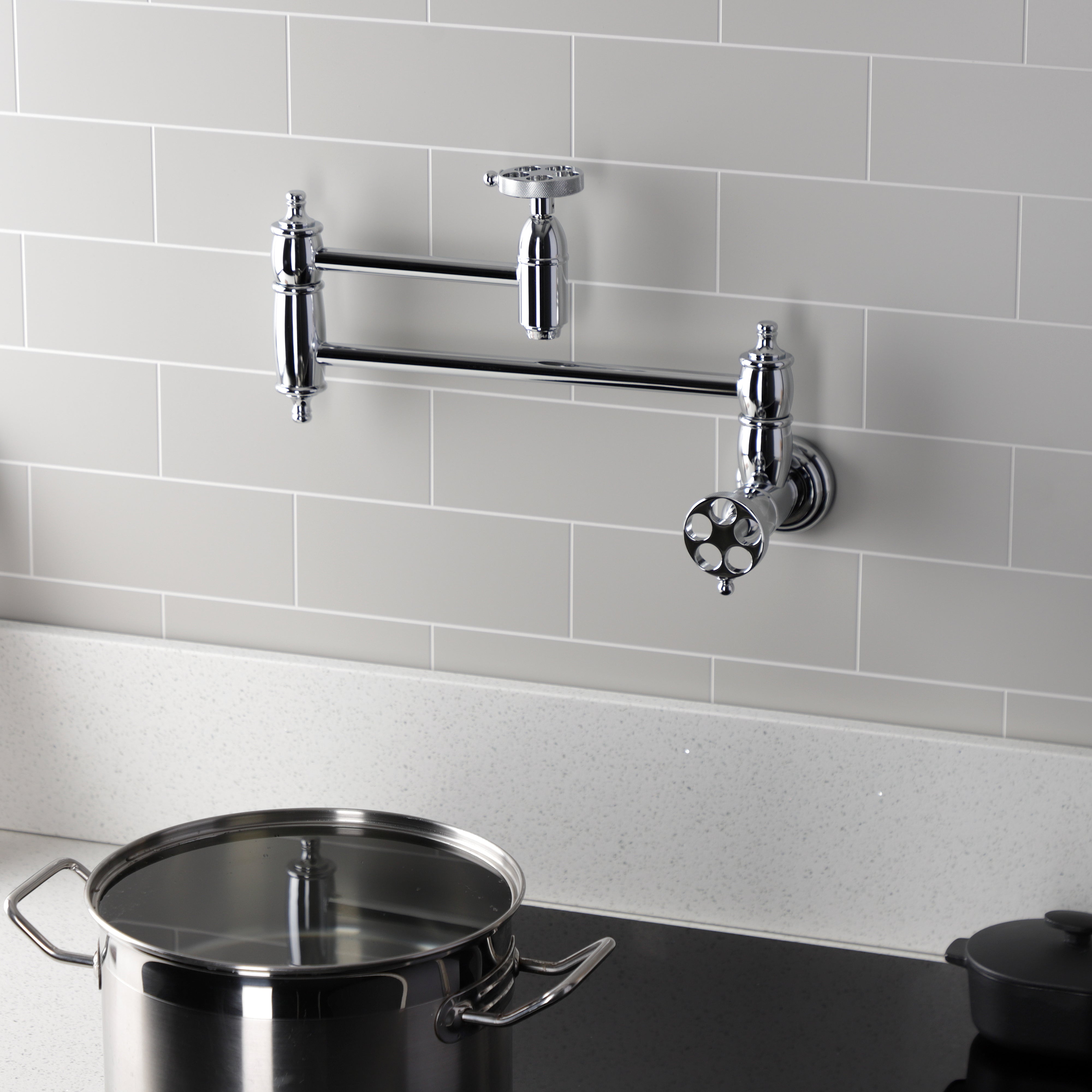 Kingston Brass KS3103RKZ Wendell Wall Mount Pot Filler Faucet with Knurled Handle, Antique Brass in a kitchen setting.
