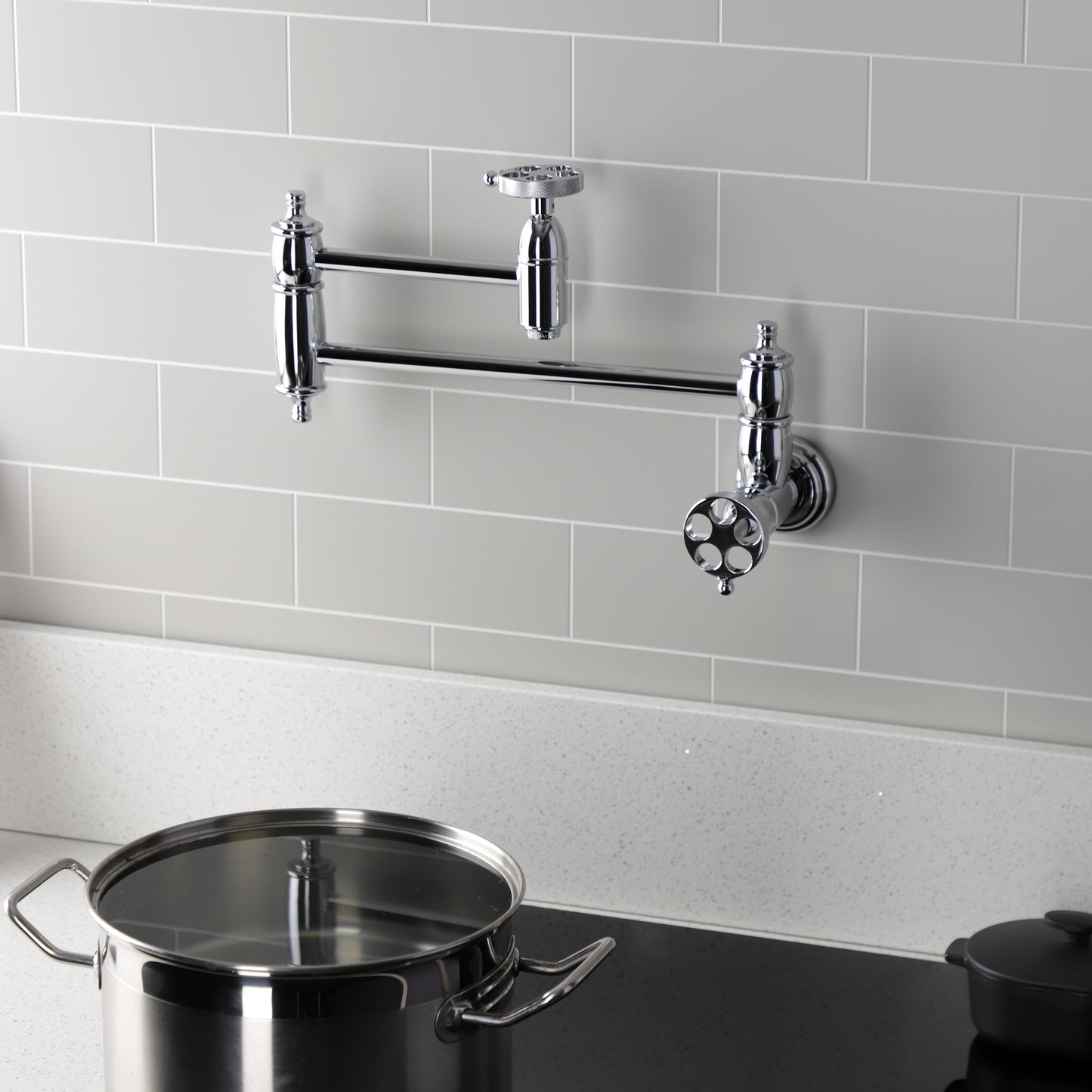 Kingston Brass KS3103RKZ Wendell Wall Mount Pot Filler Faucet with Knurled Handle, Antique Brass in a kitchen setting.