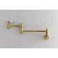 Kingston Brass KS3103PL Restoration Wall Mount Pot Filler Faucet, Antique Brass on a white tiled wall.