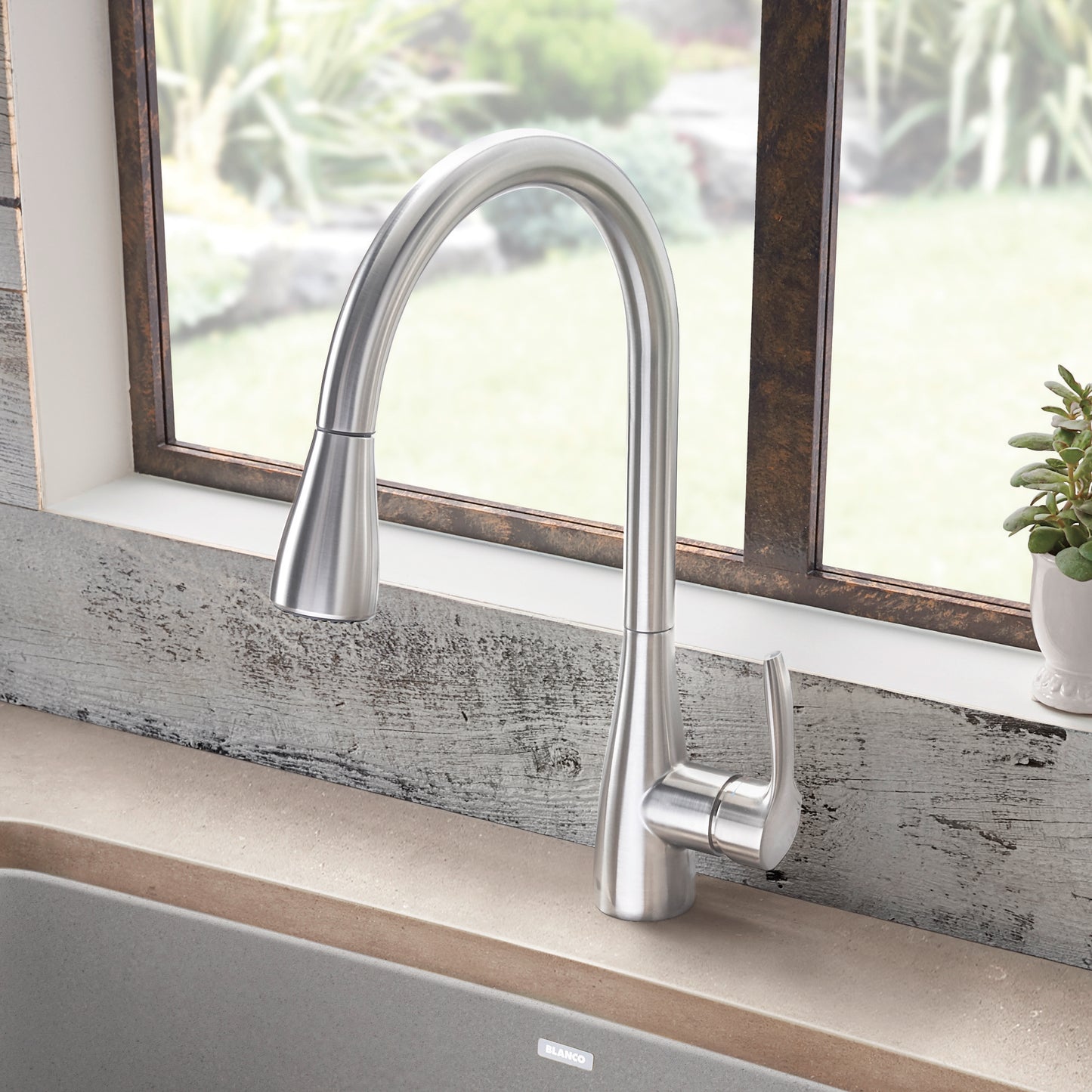 BLANCO Atura Pull-Down Dual-Spray Kitchen Faucet with high-arc spout in a modern kitchen setting.