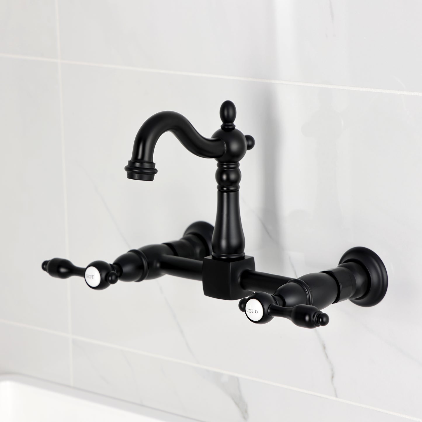 Kingston KS2443TAL Tudor Two-Handle Wall Mount Bridge Kitchen Faucet, Antique Brass with black finish.