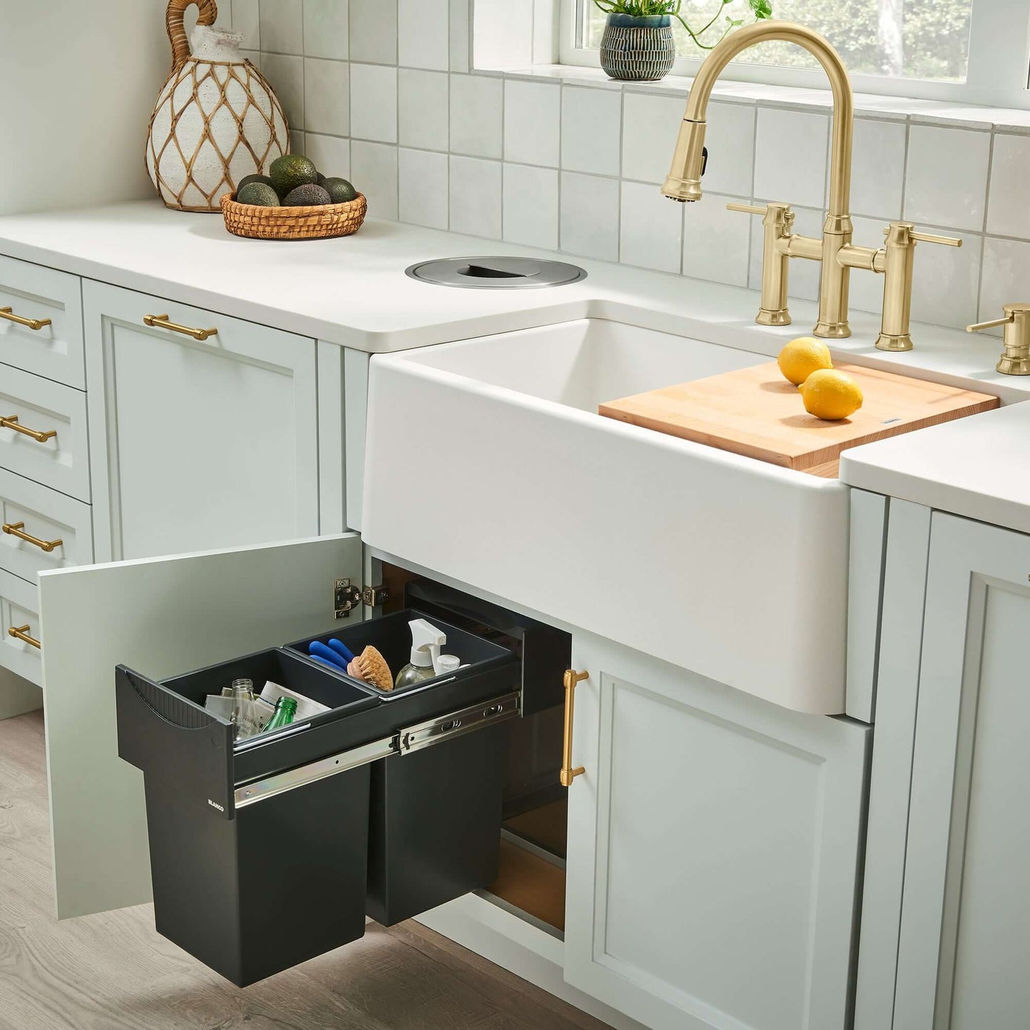 BLANCO Ikon SILGRANIT 33" Single Bowl Apron-Front Farmhouse Sink with pull-out trash bins in modern kitchen.