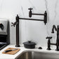 Kingston Brass KS3703AX Restoration Deck Mount Pot Filler Faucet, Antique Brass kitchen setup with pot filler and cooking tools.