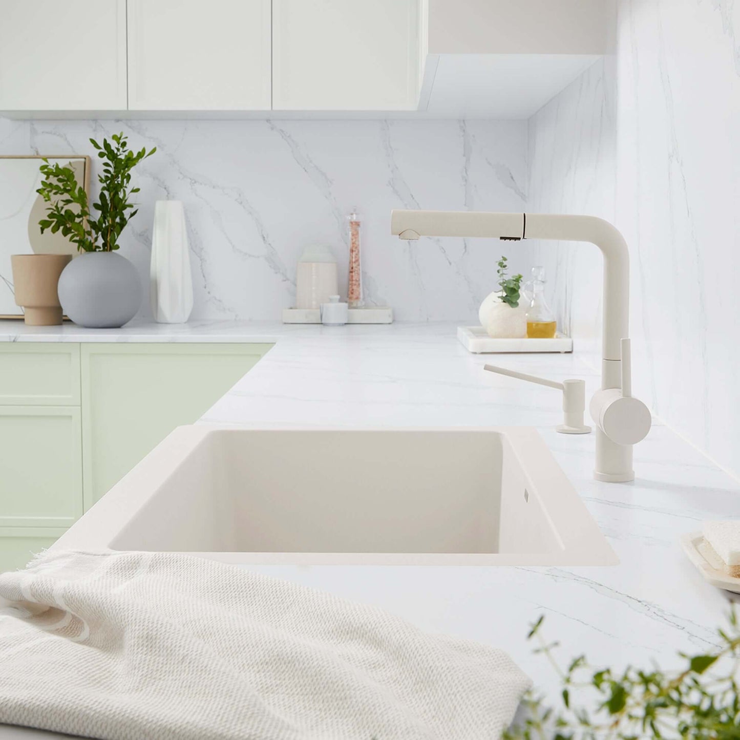 BLANCO Linus Low Arc Pull-Out Dual-Spray Kitchen Faucet - Soft White in modern kitchen setting with minimal decor.