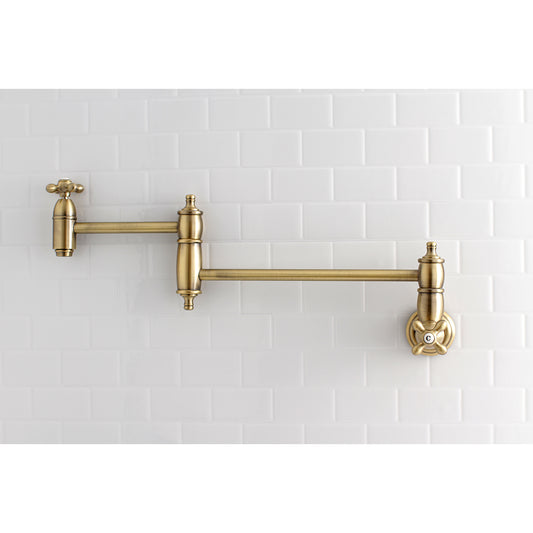 Kingston Brass KS3103AX Restoration Wall Mount Pot Filler Faucet, Antique Brass mounted on white tiled wall.