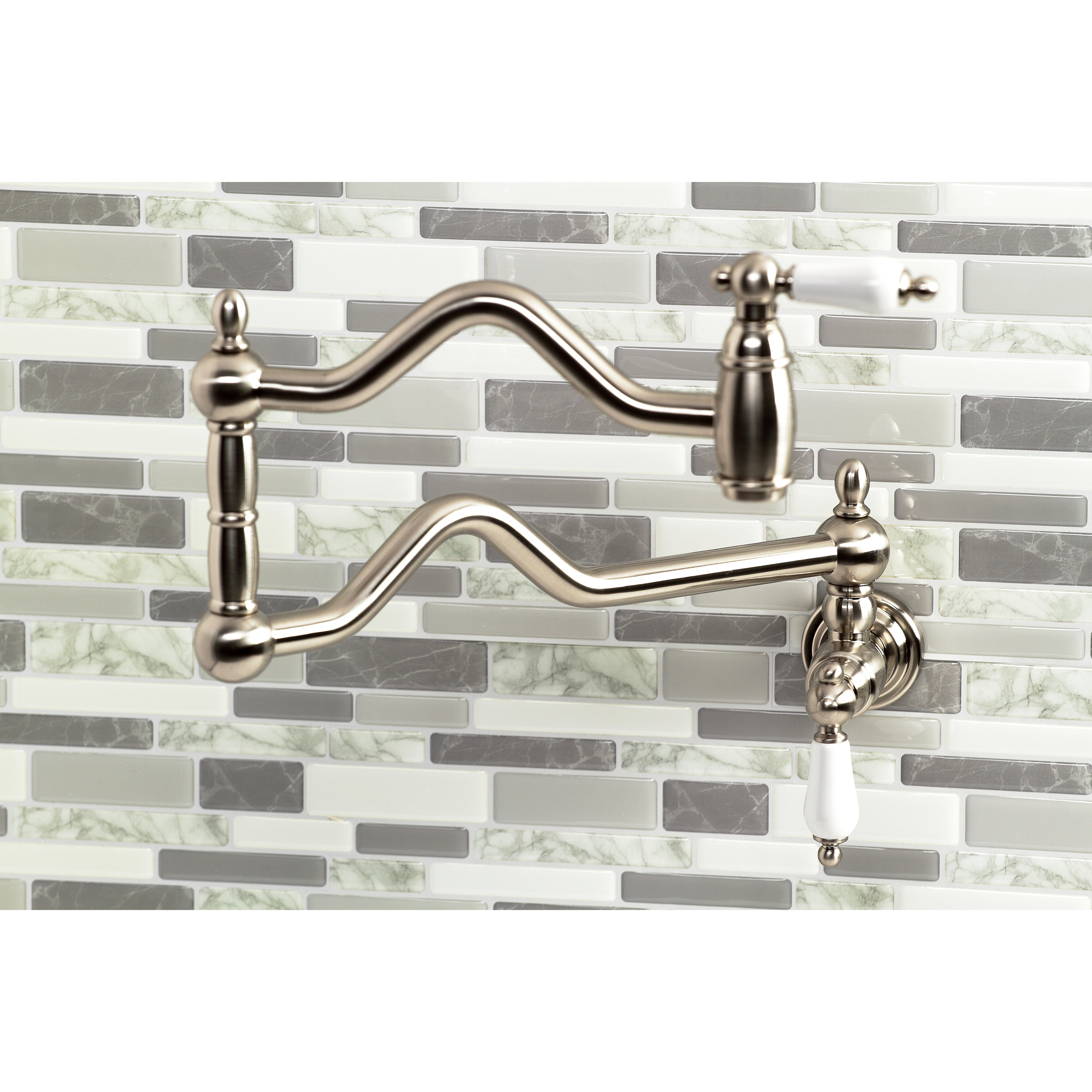 Kingston Brass KS2107PL Heritage Wall Mount Pot Filler Faucet, Brushed Brass on a stylish kitchen backsplash.