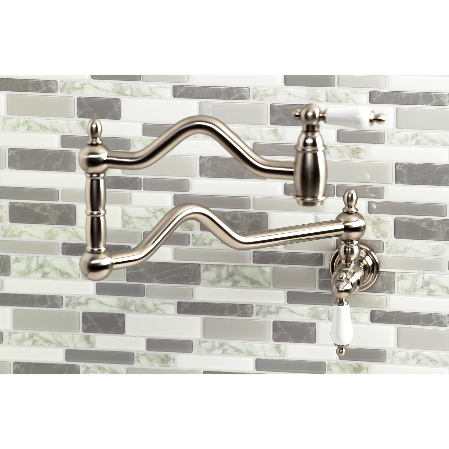 Kingston Brass KS2107PL Heritage Wall Mount Pot Filler Faucet, Brushed Brass on a stylish kitchen backsplash.