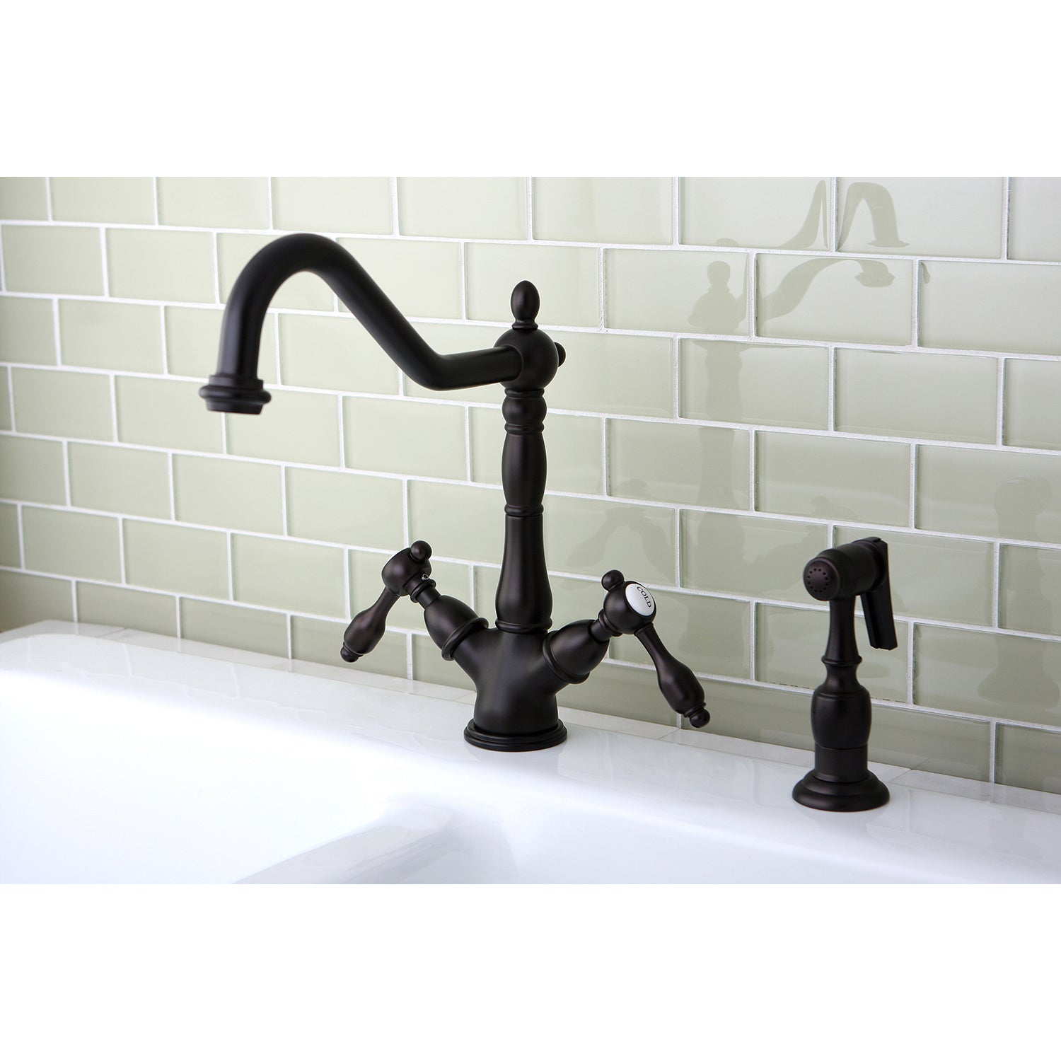 Kingston KS1238TALBS Tudor Two-Handle Kitchen Faucet with Brass Sprayer, Brushed Nickel on sink