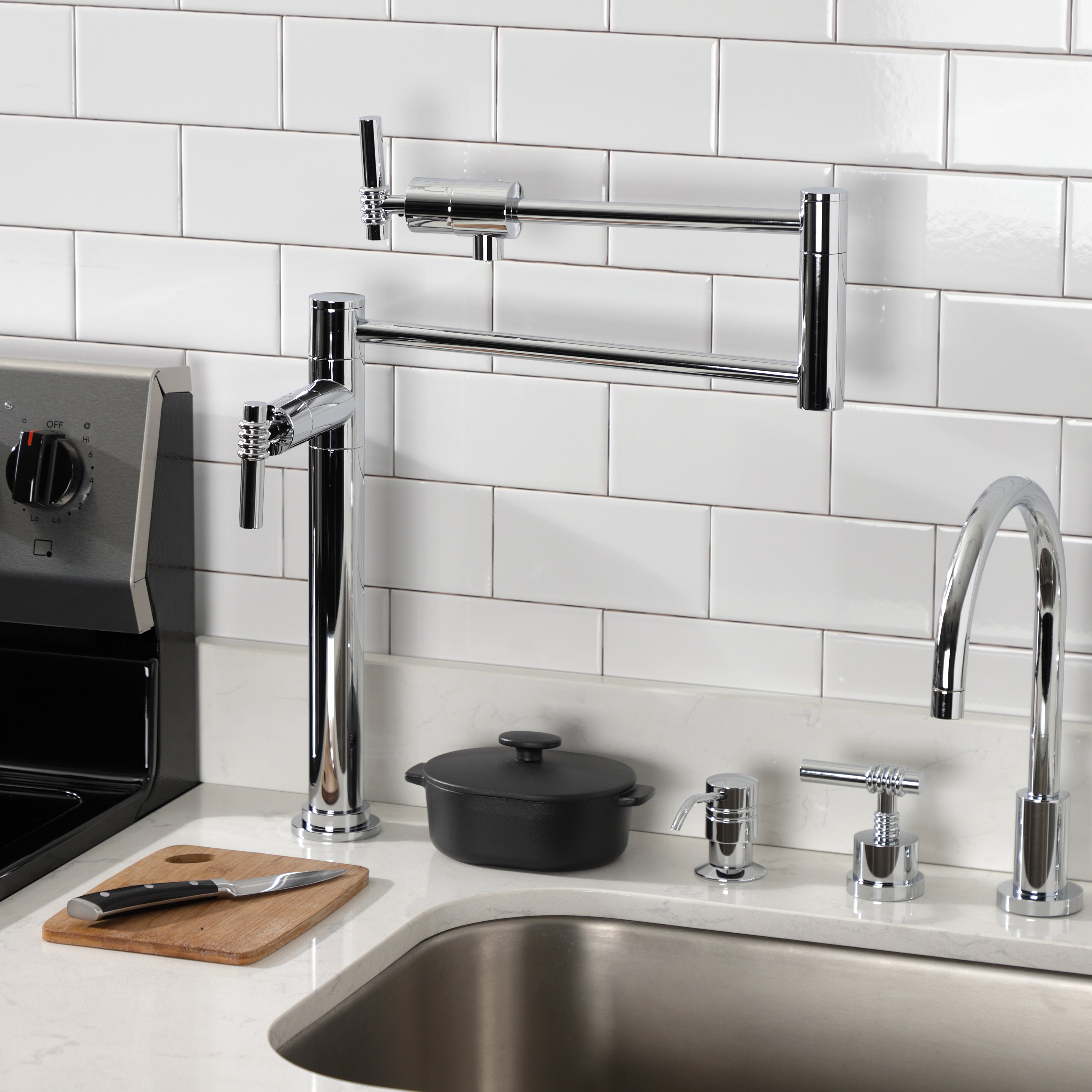 Kingston Brass KS4703ML Milano Deck Mount Pot Filler Faucet, Antique Brass in a modern kitchen setting.