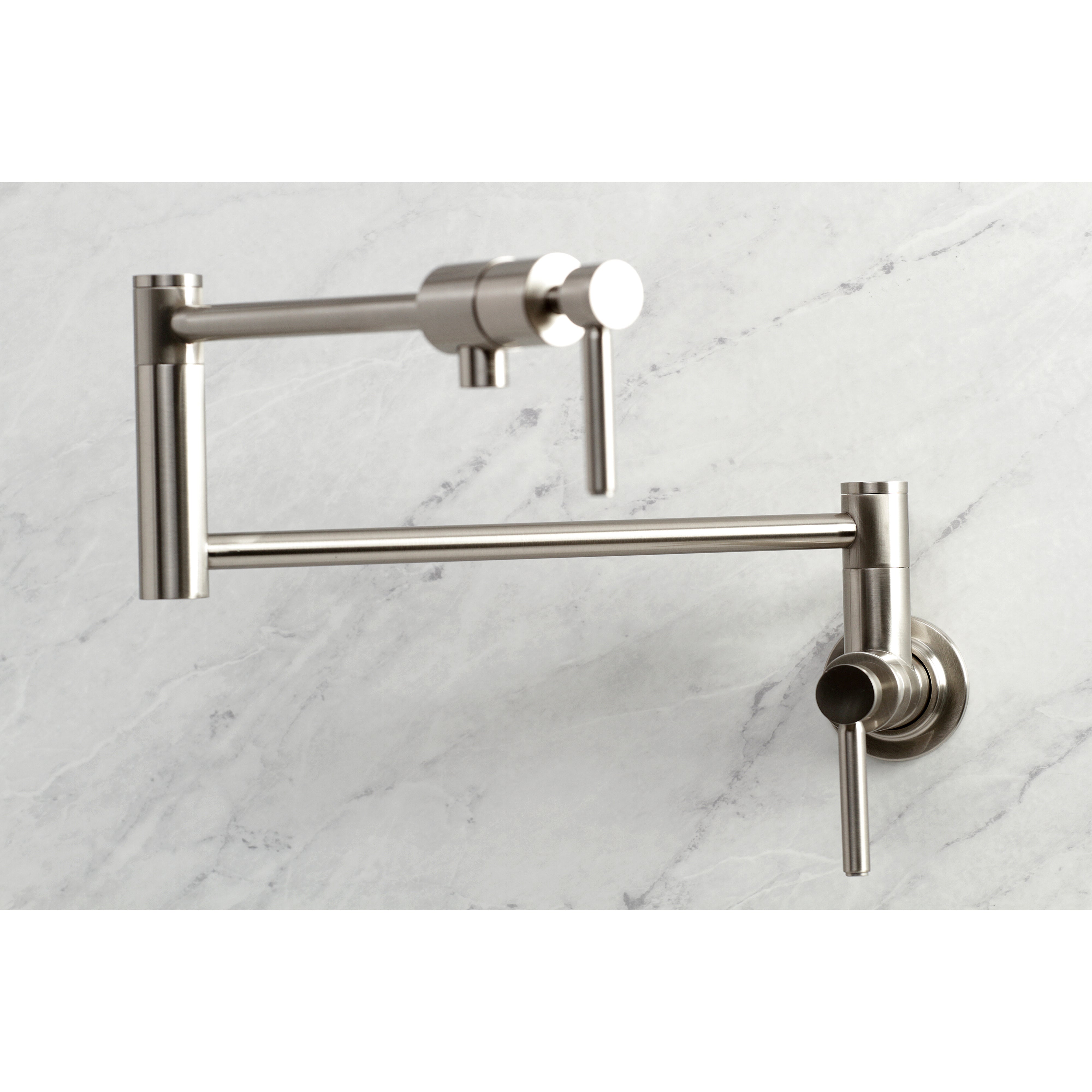 Kingston Brass KS4103DL Concord Wall Mount Pot Filler Faucet, Antique Brass on marble background.