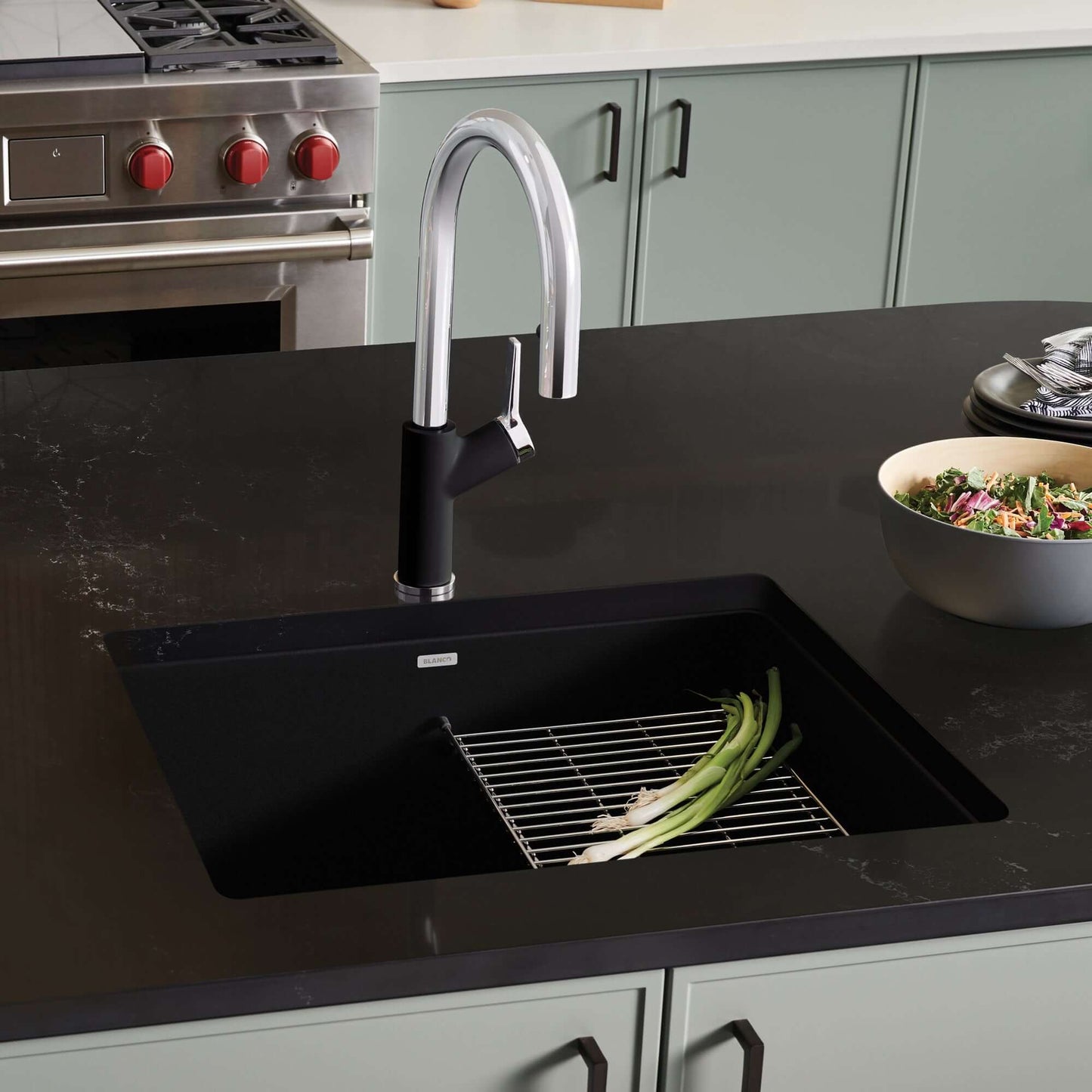BLANCO PRECIS 24" SILGRANIT Compact Undermount Sink with modern faucet in stylish kitchen setting.
