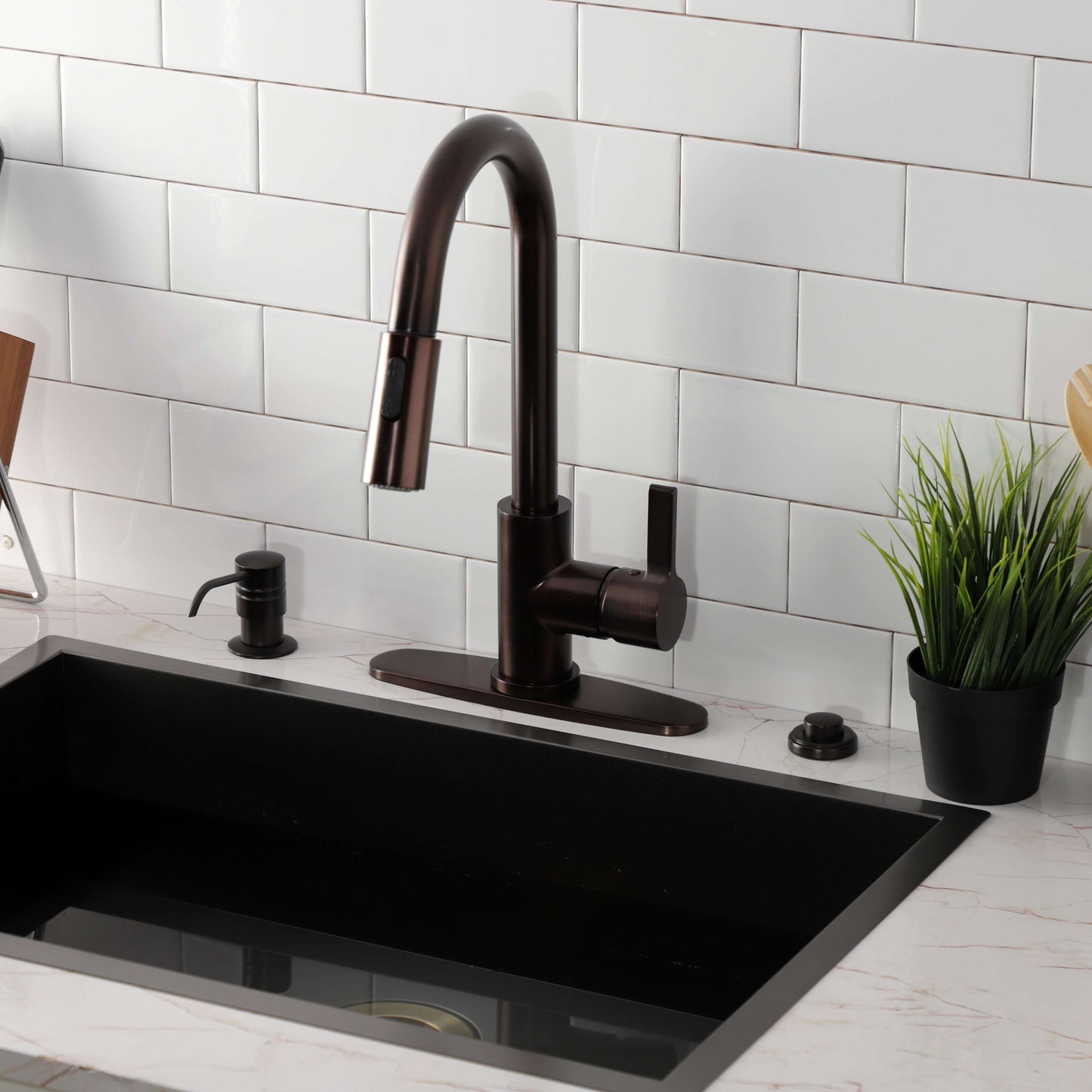Kingston Brass LS8783CTL Continental Pull-Down Kitchen Faucet in dark finish, high-arc design above black sink with countertop.