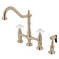 Kingston Brass Heritage Bridge Kitchen Faucet with Brass Sprayer and Cross Handles in polished nickel finish.