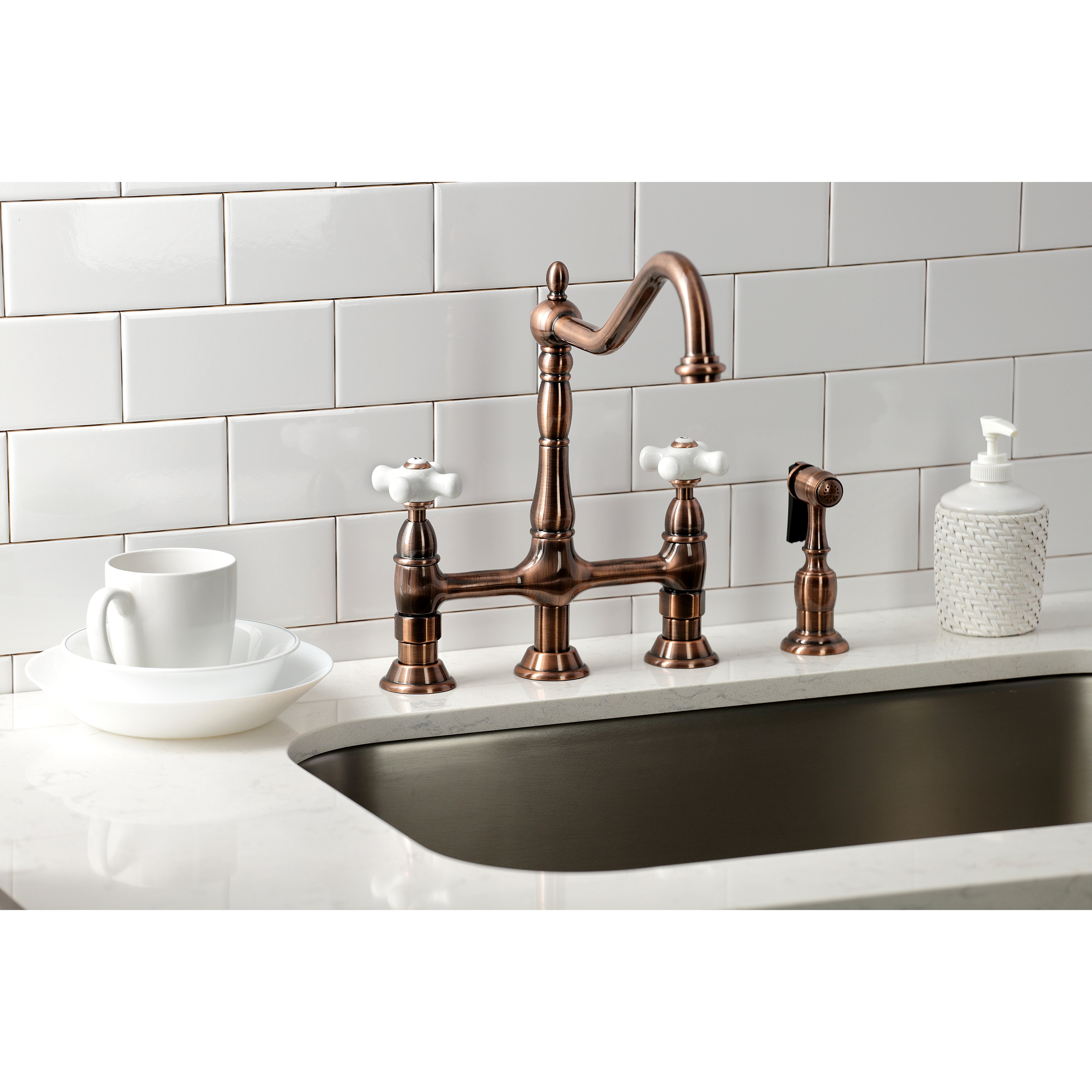 Kingston Brass Heritage Bridge Kitchen Faucet with Brass Sprayer and Cross Handles in oil rubbed bronze finish