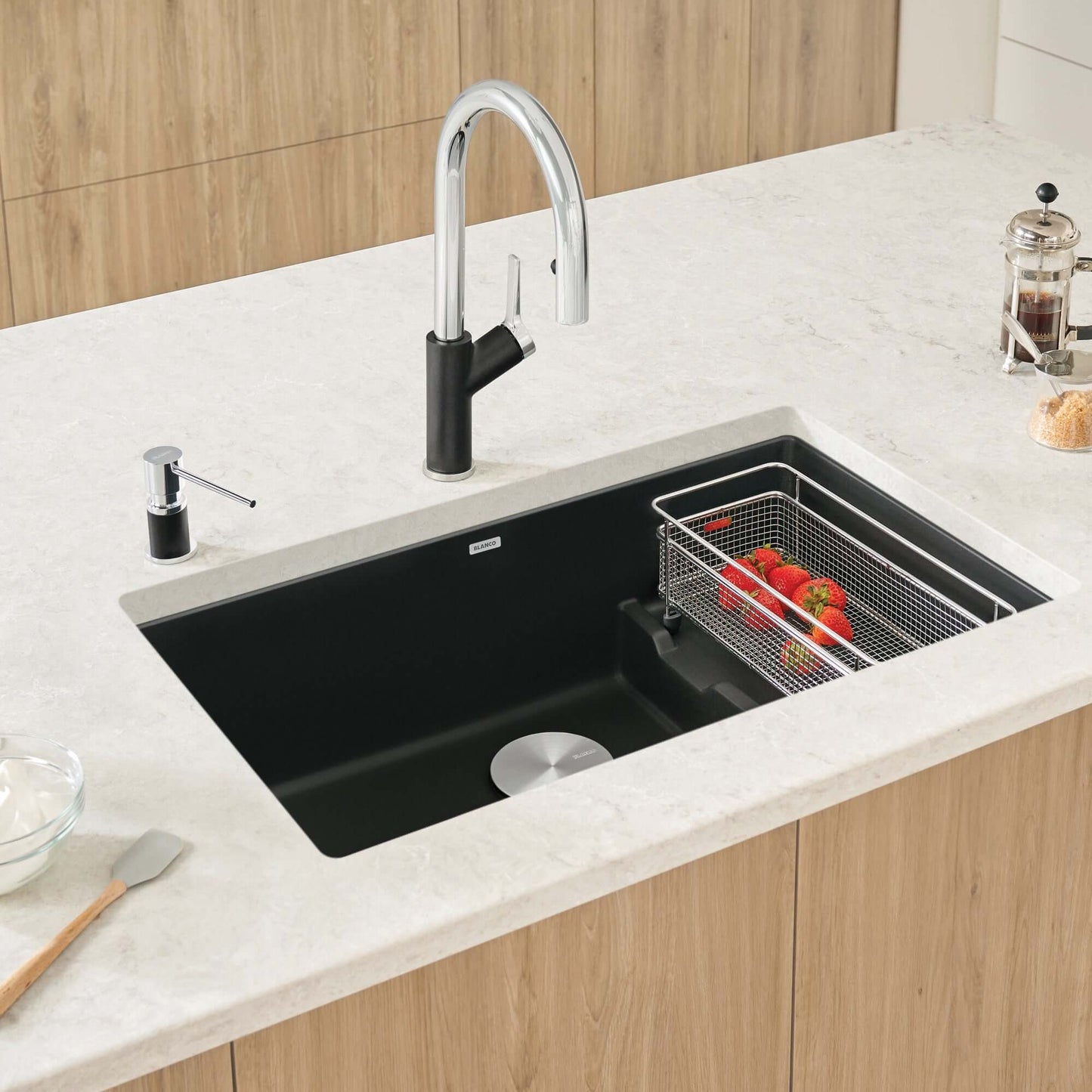 BLANCO Precis Cascade SILGRANIT 29" Single Bowl Undermount Kitchen Sink with Colander displaying strawberries in a colander.