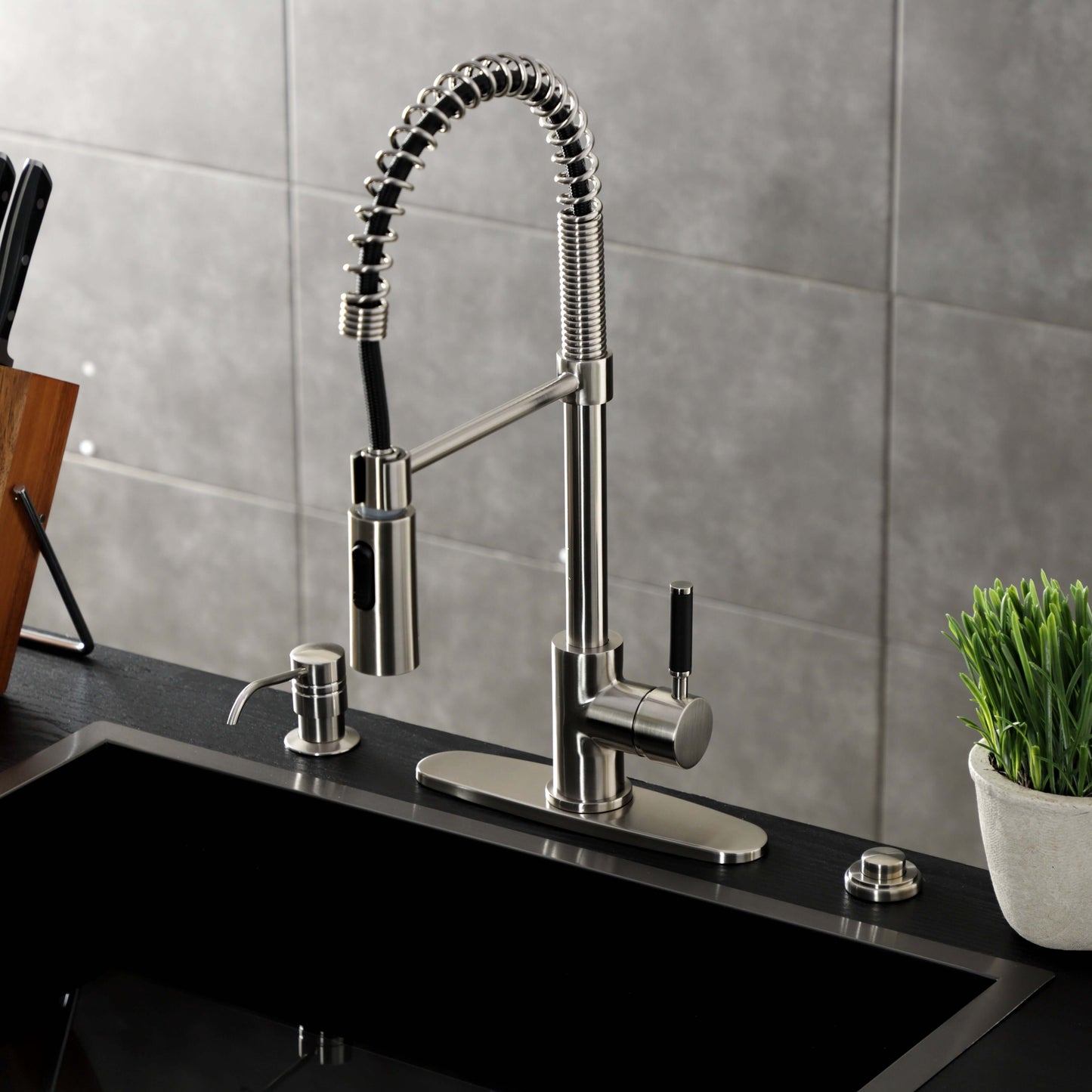 Kingston Brass LS8773DKL Kaiser Pre-Rinse Kitchen Faucet from right side showing ergonomic design and high-arching spout.