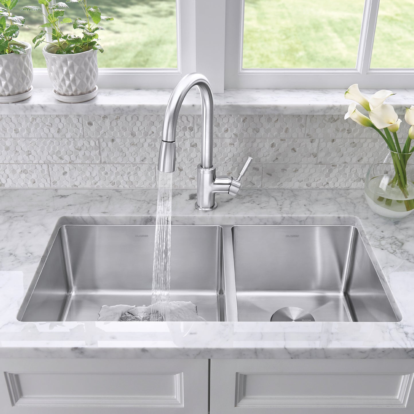 BLANCO Quatrus R15 33" 60/40 Double Bowl Undermount Stainless Steel Kitchen Sink with modern faucet and waterfall design.